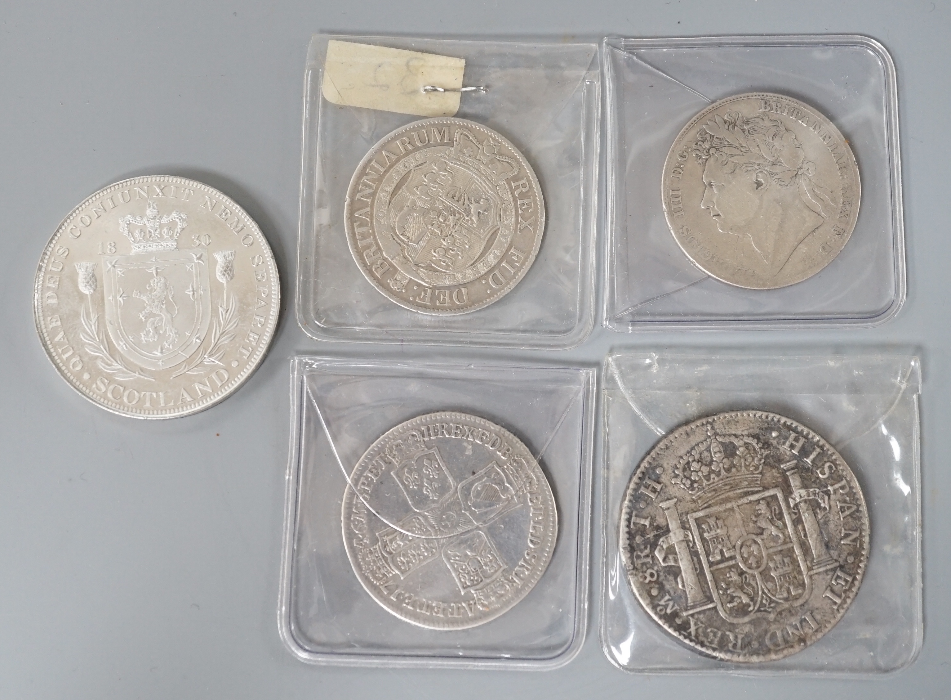 Three Georgian half crowns; 1746, 1818 & 1823 and two other coins.